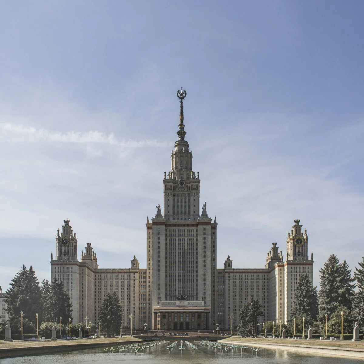 A university building with a tall tower, seen from below.