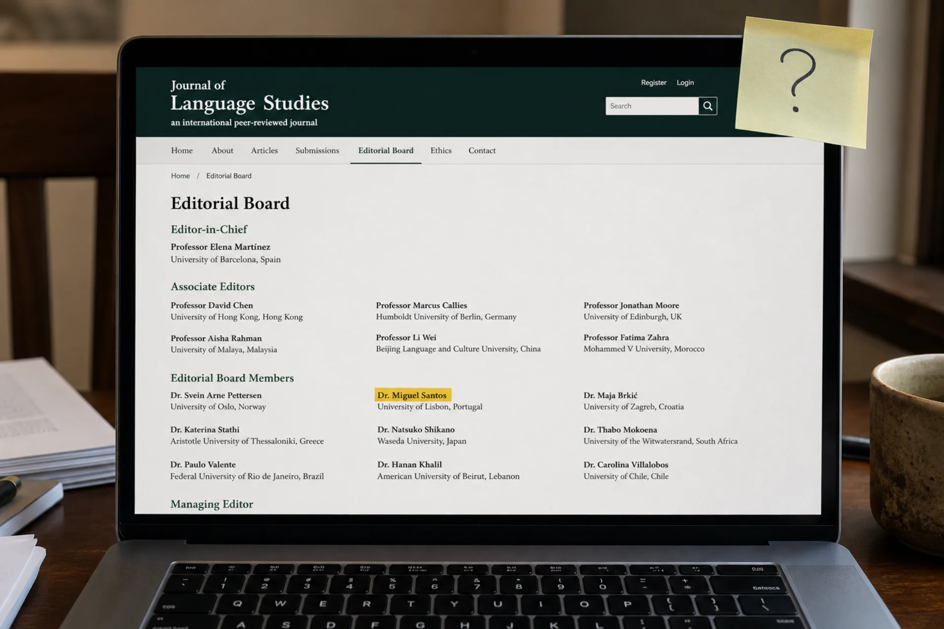 A journal website open on a laptop, its editorial board page showing.